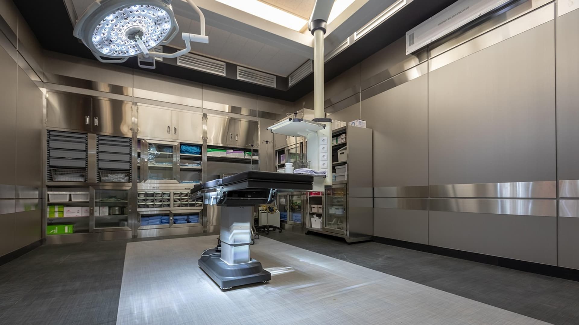 Empty, prepared operating theatre with a stainless-steel finish