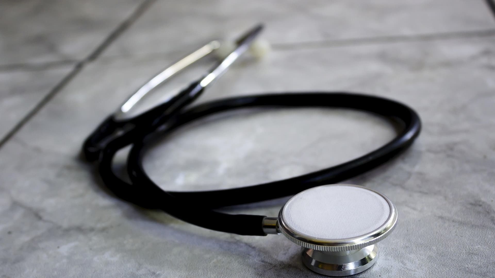 Stethoscope on a grey stone surface